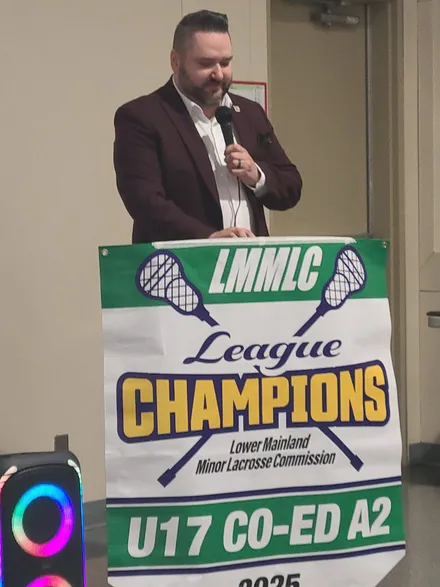 Callan Morrison speaking at the lacrosse league championship celebration.