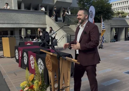 Callan Morrison speaking at a podium event.