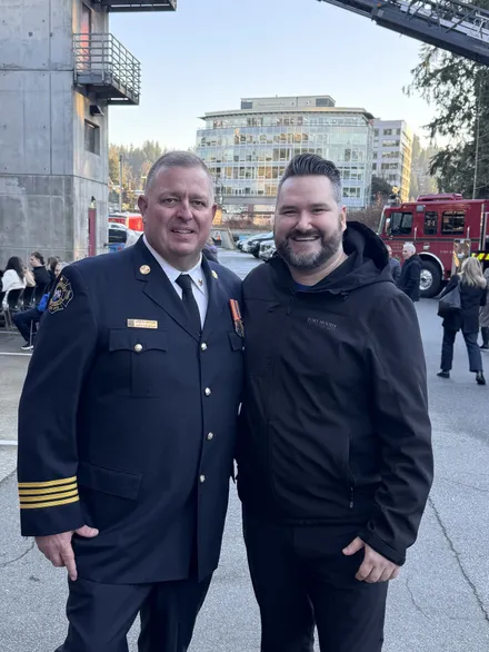 Callan Morrison with a Port Moody Fire Rescue chief.